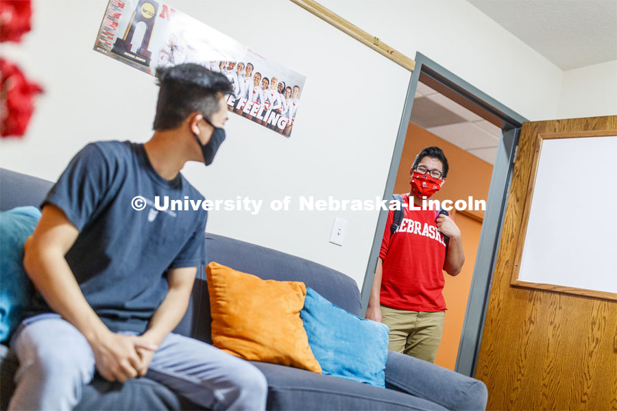 PJ Miguelino talks in a University Suites Residence Hall room. Photo shoot of students wearing masks and practicing social distancing. June 24, 2020. Photo by Craig Chandler / University Communication.
