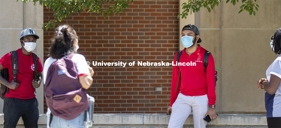 A group of students hang out wearing masks and social distancing. Photo shoot of students wearing masks and practicing social distancing. June 24, 2020. Photo by Craig Chandler / University Communication.