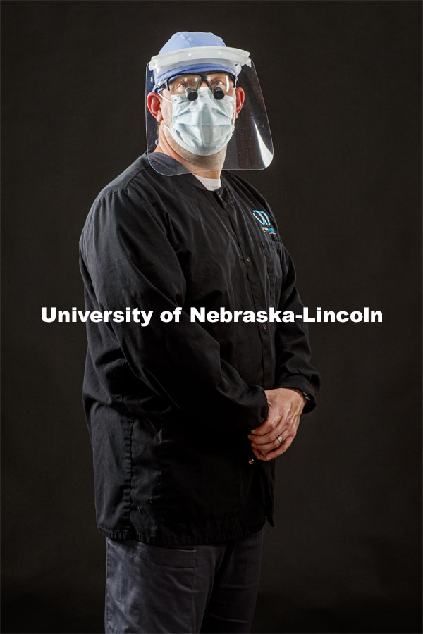 Steven Wirth, dentist with Optimal Dental in Lincoln, wears a face shield made at Innovation Campus. He wears the shields in his work. Photo for the 2019-2020 Report Representing Nebraska’s Research Heroes. June 26, 2020. Photo by Craig Chandler / University Communication.