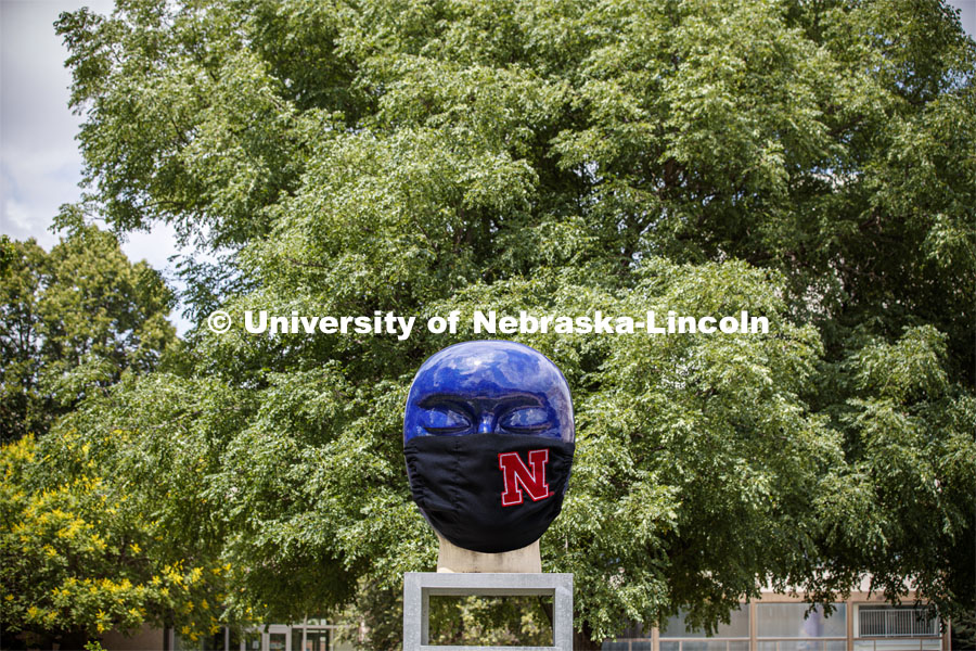 Untitled by Jun Kaneko in the Sheldon Sculpture Garden wearing a photoshopped mask. The sculpture is one of many UNL campus sculptures wearing masks. Mask wearing statues on campusJune 30, 2020. Photo by Craig Chandler / University Communication.