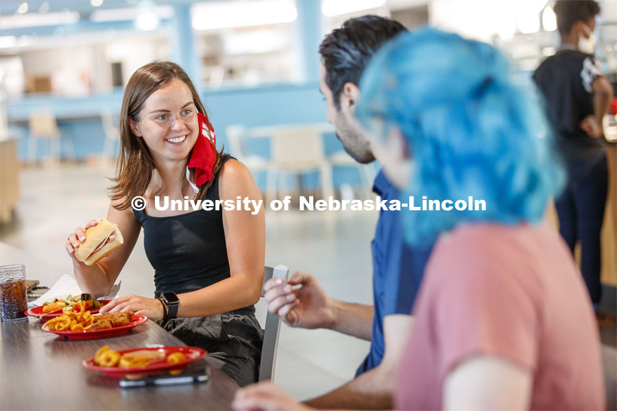 Students eating in the Willa Cather Dining Center. Photo shoot of students wearing masks and practicing social distancing in dining services in Willa Cather Dining Center. July 1, 2020. Photo by Craig Chandler / University Communication.