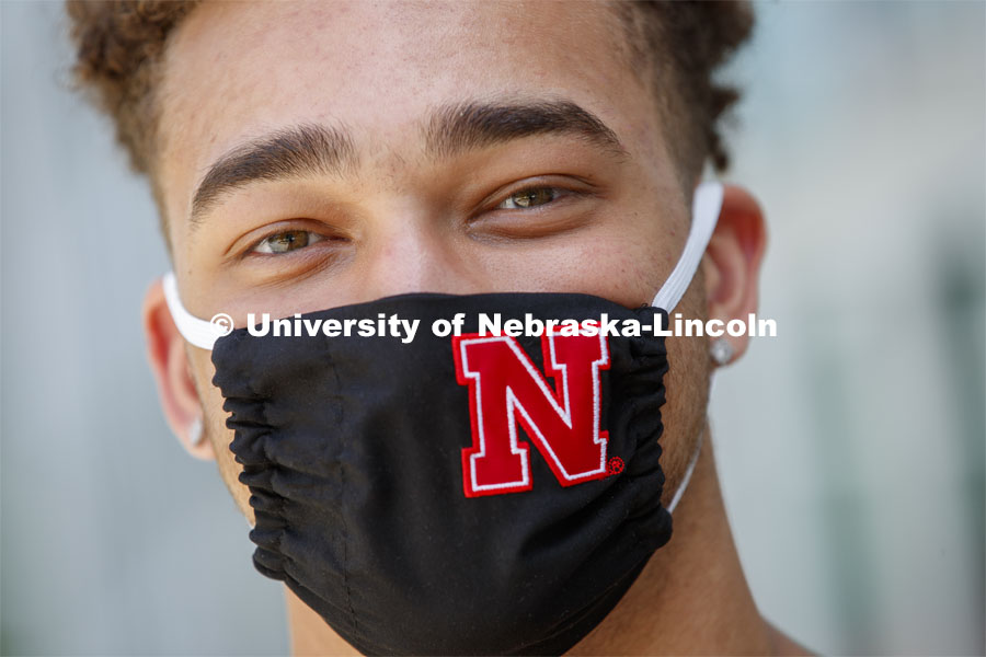 Hunter Johnson, a Junior in finance from Omaha wears a Husker mask. Photo shoot of students wearing masks and practicing social distancing in dining services in Willa Cather Dining Center. July 1, 2020. Photo by Craig Chandler / University Communication.
