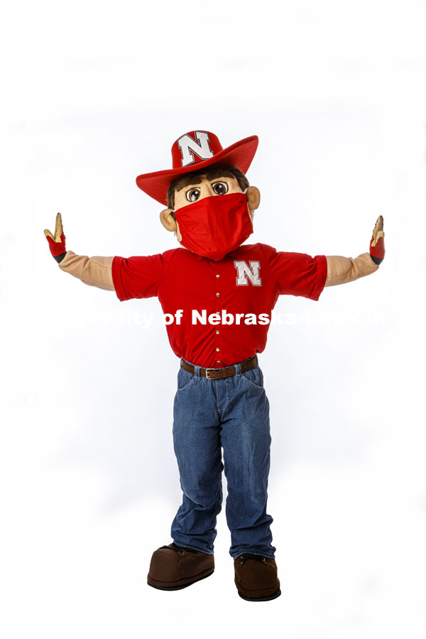 Herbie Husker wears a protective mask while he poses on campus. July 09, 2020. Photo by Craig Chandler / University Communication.