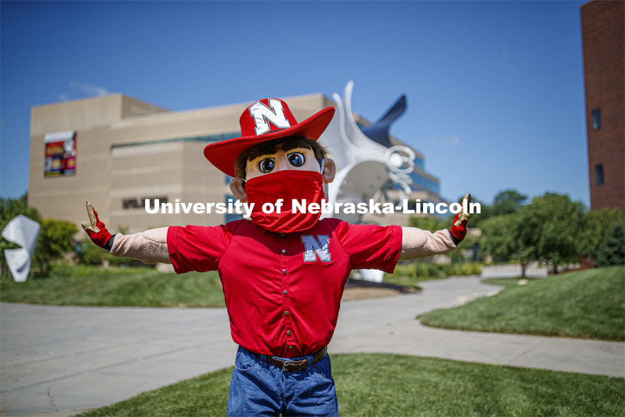 Herbie Husker wears a protective mask while he poses on campus. July 09, 2020. Photo by Craig Chandler / University Communication.