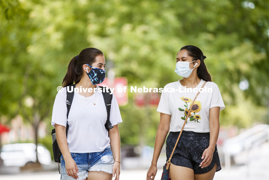 Anamaría Guzmán and Shridula Hegde walk through city campus. August 4, 2020. Photo by Craig Chandler / University Communication.