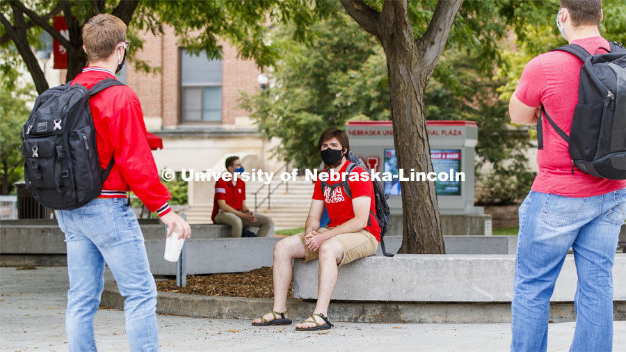 Photo shoot of students on city campus display mask wearing and social distancing. Students wear masks while socializing in the commons area outside the Nebraska Union. August 5, 2020. Photo by Craig Chandler / University Communication.
