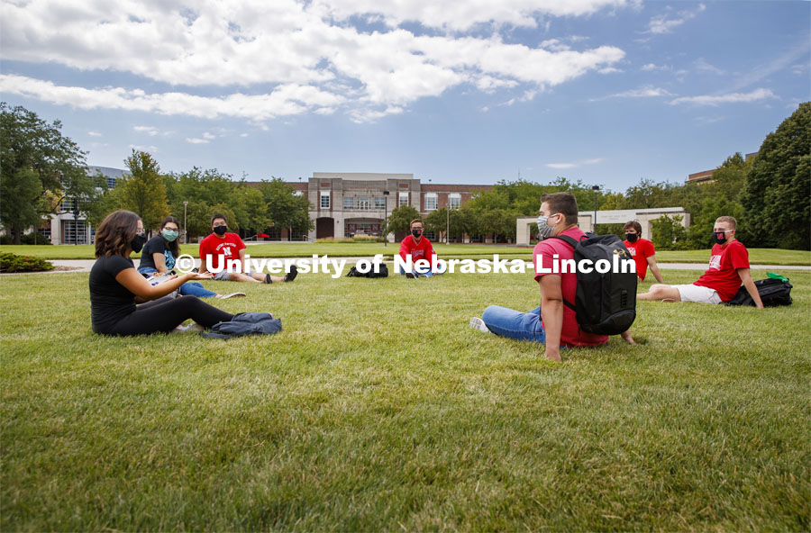 Photo shoot of students on city campus display mask wearing and social distancing. Students hang out in the grassy commons area between the Nebraska Union and Kauffman. August 5, 2020. Photo by Craig Chandler / University Communication.