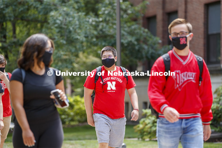 Photo shoot of students on city campus display mask wearing and social distancing. Students wearing masks while crossing campus to get to class. August 5, 2020. Photo by Craig Chandler / University Communication.