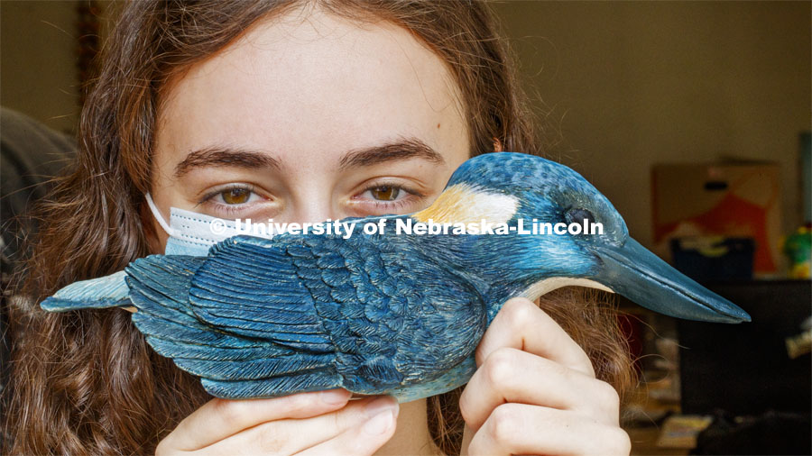 Kinga Aletto, junior in College of Agriculture Sciences and Natural Resources, works on a life-size clay model of the Javan blue-banded kingfisher. Her UCARE research project includes making a life size Javan Blue-banded king out of clay. The reason why this bird was chosen was because it is critically endangered and receives little to no coverage on this fact. Through learning new clay building skills, she is able to bring this bird to life in Nebraska and bring awareness to its' struggles. August 7, 2020. Photo by Craig Chandler / University Communication.