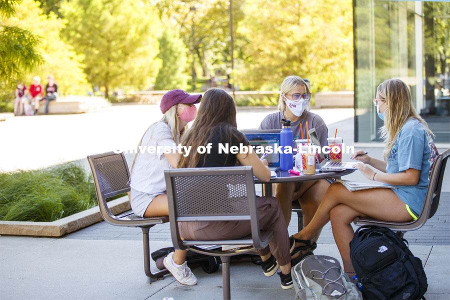 Alexis Carter talks with fellow Alpha Phi sorority members as they study outside of Adele Coryell Hall Learning Commons. First Day of classes on UNL campus. August 17, 2020. Photo by Craig Chandler / University Communication.