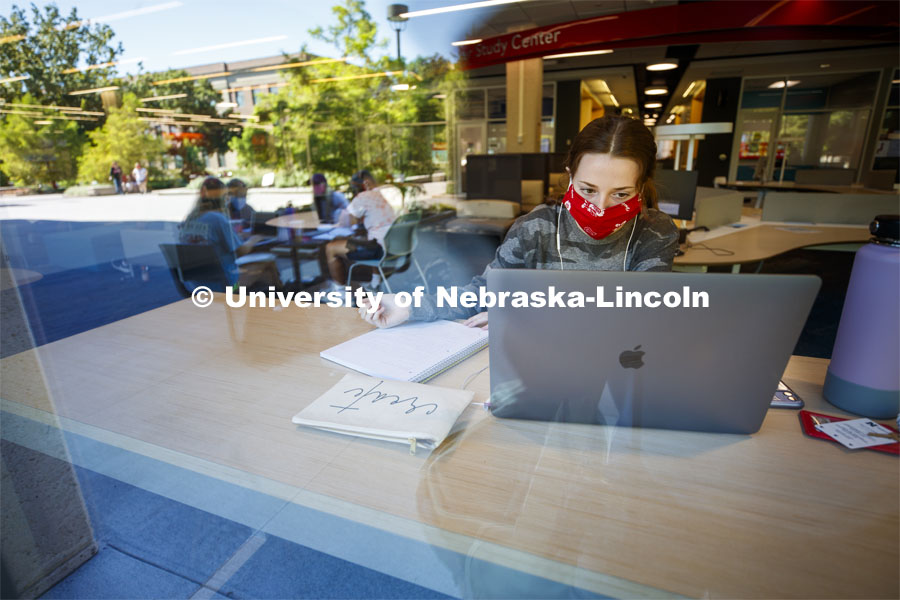 Anna Miles, a freshman from Benson, Arizona, studies from a table with a window view in the Adele Coryell Hall Learning Commons. First Day of classes on UNL campus. August 17, 2020. Photo by Craig Chandler / University Communication.