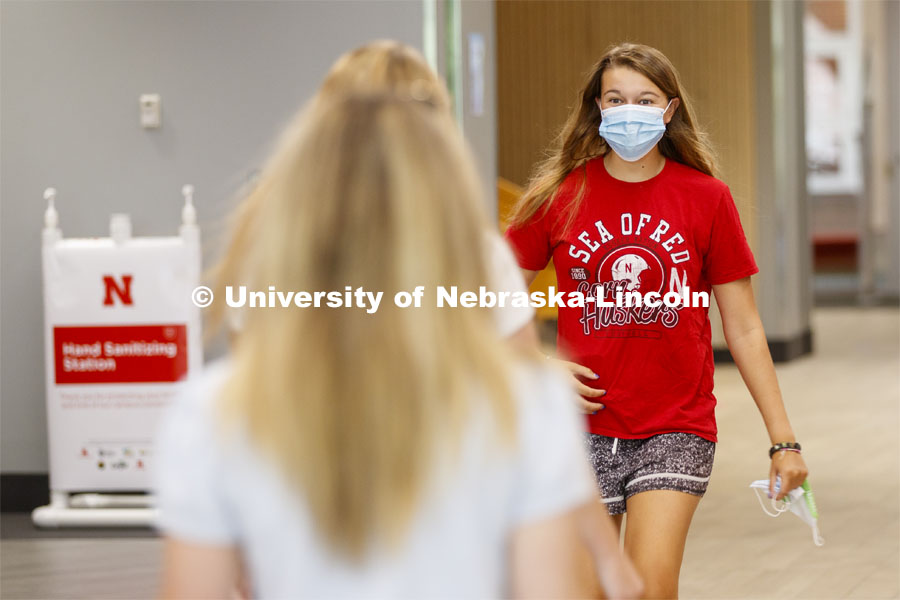 Allison Vana, a sophomore from Omaha, reacts as she sees friends on the first day of classes on UNL campus. August 17, 2020. Photo by Craig Chandler / University Communication.