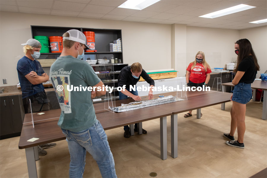 Michael Kaiser, Assistant Professor of Agronomy and Horticulture, arranges a soil sample for student to observe. First day of in-person learning for the fall semester. August 24, 2020. Photo by Gregory Nathan / University Communication.