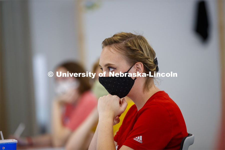 Kayla LaPoure listens to Anna Henson teach her Principles of Interactivity course in the Carson Center Monday afternoon. First day for in-person learning for the fall semester. August 24, 2020. Photo by Craig Chandler / University Communication.