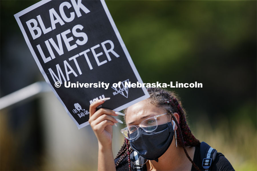 Kiara Williams holds a Black Lives Matter sign at the sit-in sponsored by the Black Student Union to draw attention to the shooting of Jacob Blake in Kenosha, WI. August 25, 2020. Photo by Craig Chandler / University Communication.