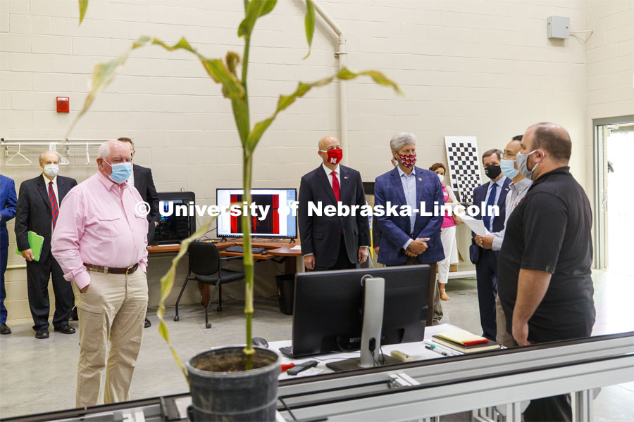 United States Secretary of Agriculture Sonny Perdue, Nebraska Governor Pete Ricketts and Nebraska Congressman Jeff Fortenberry watch a corn plant roll through the phenotyping system during a demonstration at the Greenhouse Innovation Center. September 4, 2020. Photo by Craig Chandler / University Communication.