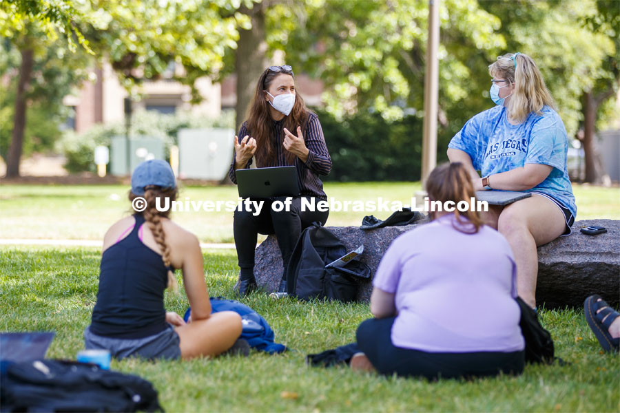Assistant Professor Katie Anania teaches her Visualizing Crisis: Food, Water and Biopolitics class in the shade of a tree outside of Woods Art Building. On campus. September 15, 2020. Photo by Craig Chandler / University Communication.