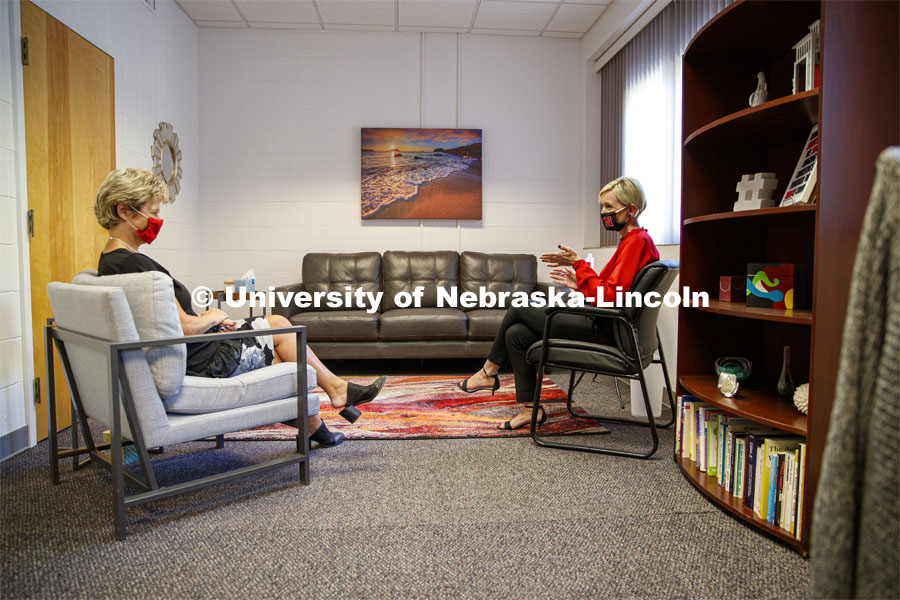 Kyla Gorji (left), director of Nebraska's Employee Assistance Program, sits with Valerie Williams, a counselor with the program, in their office on campus. The EAP is currently offering in-person counseling sessions on Wednesdays. September 30, 2020. Photo by Craig Chandler / University Communication.