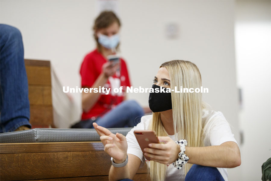 Students checking their phones inside the remodeled Nebraska East Union. East Campus photo shoot. October 13, 2020. Photo by Craig Chandler / University Communication.