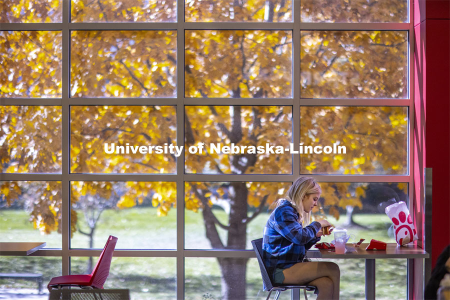 A young woman enjoying lunch in the Nebraska Union on City Campus. November 4, 2020. Photo by Craig Chandler / University Communication.