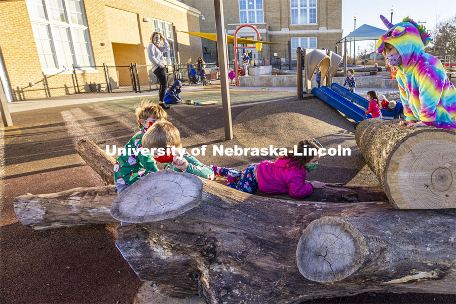 Children at the University of Nebraska-Lincoln Children's Center spent time on pajama day climbing on actual trees placed on the playground. December 7, 2020. Photo by Craig Chandler / University Communication.