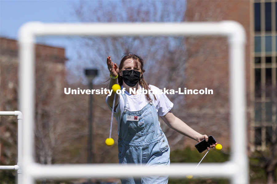 Jillian Baker plays ladder toss at Spring Breakout Festival. Students have fun at the Spring Breakout, a midday festival with free games, music, and prizes. 300 free t-shirts for participants. March 29, 2021. Photo by Craig Chandler / University Communication.