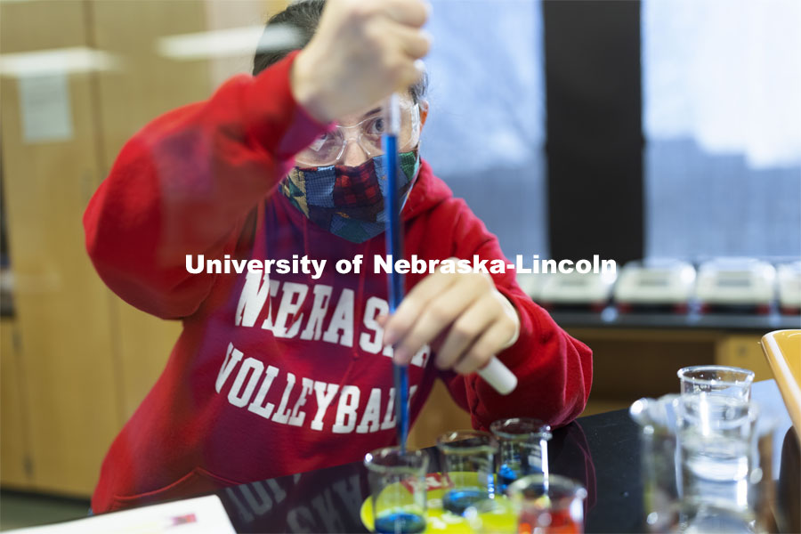 Rachel Clarkson, a freshman from Gilbert, Arizona, measures the dye in her pipette. Students perform spectral analysis on colored liquids in the chemistry 109 lab. Chemistry Labs in Hamilton Hall. April 1, 2021. Photo by Craig Chandler / University Communication.