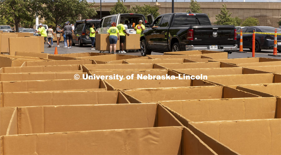 Dozens of boxes await their turn to help move Husker into their residence halls. Early arrival move-in for sorority rush, First Husker and Emerging Leaders. August 15, 2021. Photo by Craig Chandler / University Communication.
