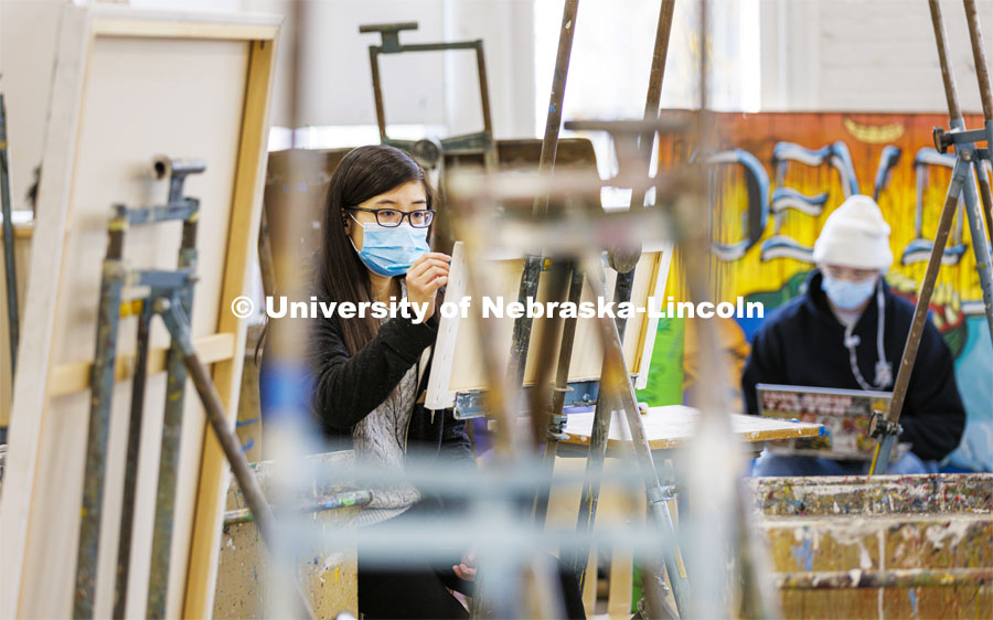 Nancy Nguyen, senior from Lincoln, works on a sketch in Aaron Holz’ Intermediate Painting class in Richards Hall. December 1, 2021. Photo by Craig Chandler / University Communication.