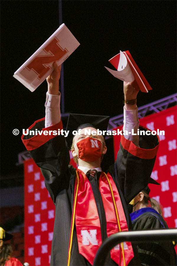 Arts and Sciences graduate Tyler Banark celebrates as he walks off the stage at the Undergraduate Commencement at Pinnacle Bank Arena. December 18, 2021. Photo by Craig Chandler / University Communication.