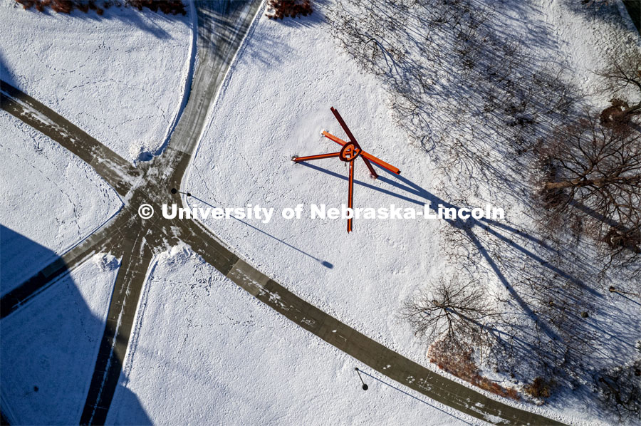 Aerial view of the five sidewalks that come together near the Old Glory Sculpture. Winter snow scenes. January 3, 2022. Photo by Craig Chandler / University Communication.