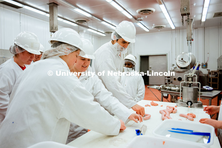 Students were encouraged to participate in the sausage-making process to further understand the lessons. UNL Meat Science club had a Sausage Making 101 course in the Animal Science Complex. February 28, 2022. Photo by Jonah Tran / University Communication.