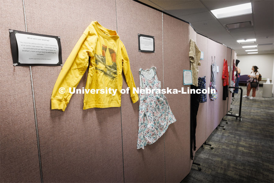 The “What Were You Wearing?” survivor art installation in the new CARE space within Neihardt features a display of recreations of outfits worn by those who were sexually assaulted with accompanying stories from the survivors. It was shown in Neihardt Center as a way for Huskers to see the space CARE will move into during the summer. April 12, 2022. Photo by Craig Chandler / University Communication.