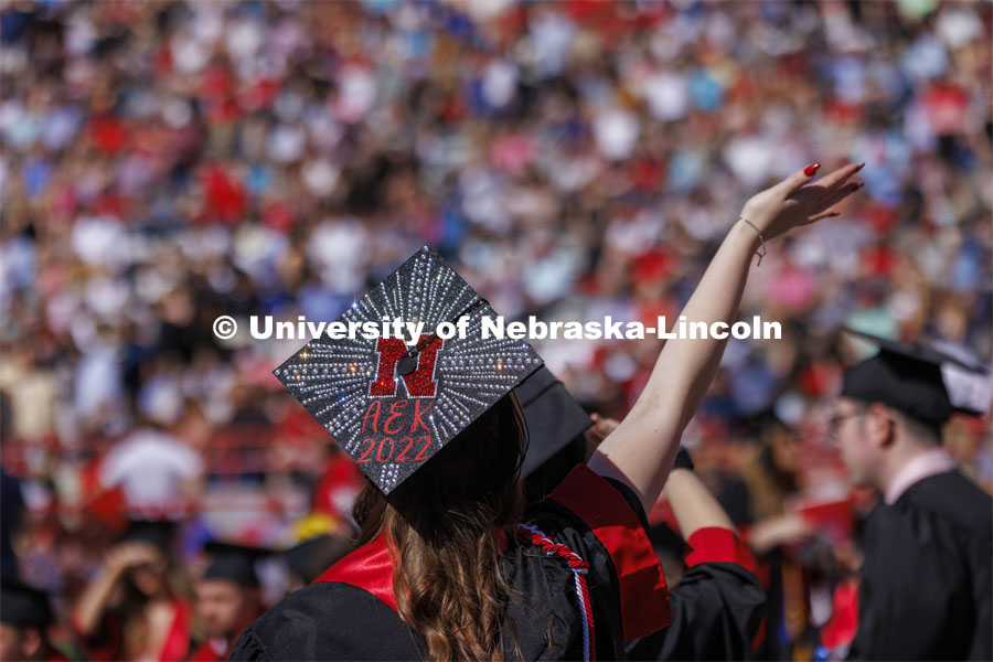 Ashton Koch’s bedazzled mortarboard sparkles in the morning sun. UNL undergraduate commencement in Memorial Stadium. May 14, 2022. Photo by Craig Chandler / University Communication.