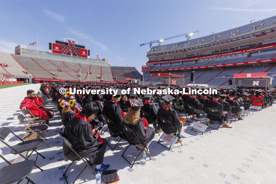 Students are seated at the UNL undergraduate commencement in Memorial Stadium. May 14, 2022. Photo by Craig Chandler / University Communication.