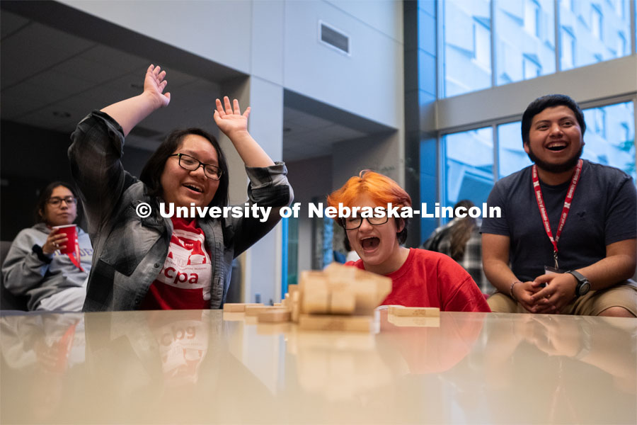 Attendees of the Nebraska College Preparatory Academy Science Camp react after a Jenga tower falls inside of Abel Hall during the Nebraska College Preparatory Academy’s Science Camp. NCPA, a program for academically talented, first-generation, income eligible students to help prepare them for college and their future careers. June 9, 2022. Photo by Jordan Opp for University Communication.