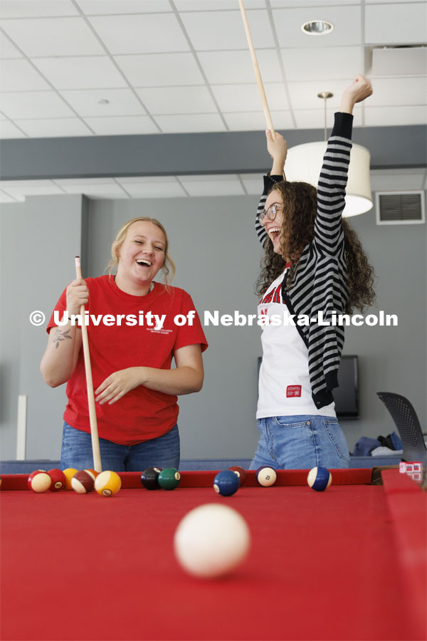 Students playing a game of pool. Housing Photo Shoot in Able Sandoz Residence Hall. September 27, 2022. Photo by Craig Chandler / University Communication.