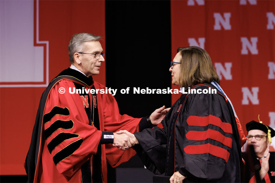 Chancellor Ronnie Green greets Deb Fischer, United States Senator for Nebraska, before she gives the commencement address. Winter Undergraduate Commencement in Pinnacle Bank Arena. December 17, 2022. Photo by Craig Chandler / University Communication.
