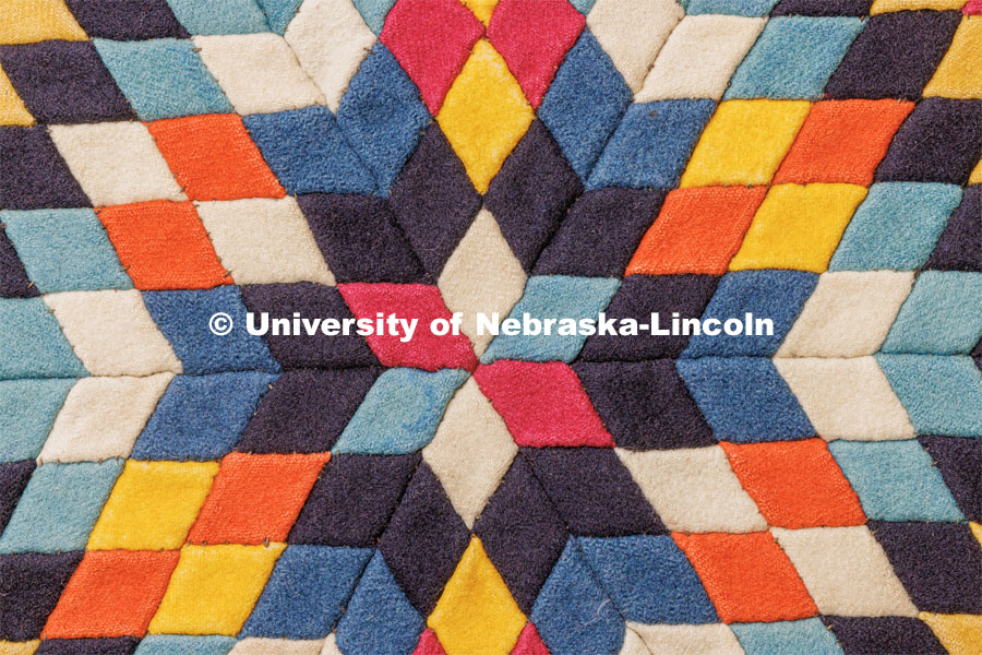A detail from a soldier’s quilt possibly made in the United States in the period between 1880-1900. Quilt Center. February 8, 2023. Photo by Craig Chandler / University Communication.
