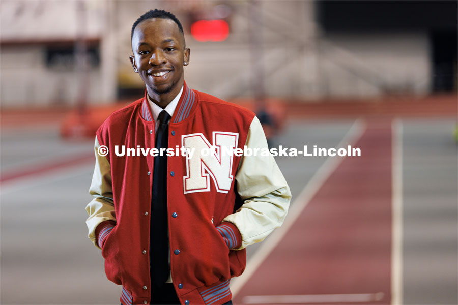 Nebraska's Passmore Mudundulu is pictured in the Devaney Sports Center by the track. Mudundulu is a junior marketing major from Lincoln and a long and triple jumper with the Husker Track Team. Photo for Black History Month profile. February 10, 2023. Photo by Craig Chandler / University Communication.
