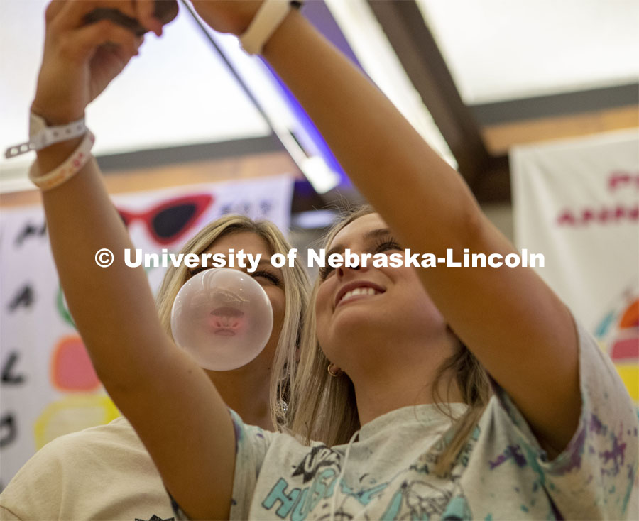 Ashton Sandman poses for a selfie with Addy Timmerman during the bubble blowing competition at Huskerthon 2023. University of Nebraska–Lincoln students raised $118,208 during the annual HuskerThon on Feb. 25. Also known as Dance Marathon, the event is part of a nationwide fundraiser supporting Children’s Miracle Network Hospitals. The annual event, which launched in 2006, is the largest student philanthropic event on campus. The mission of the event encourages participants to, “dance for those who can’t.” All funds collected by the Huskers benefit the Children’s Hospital and Medical Center in Omaha. February 25, 2023. Photo by Blaney Dreifurst for University Communication.