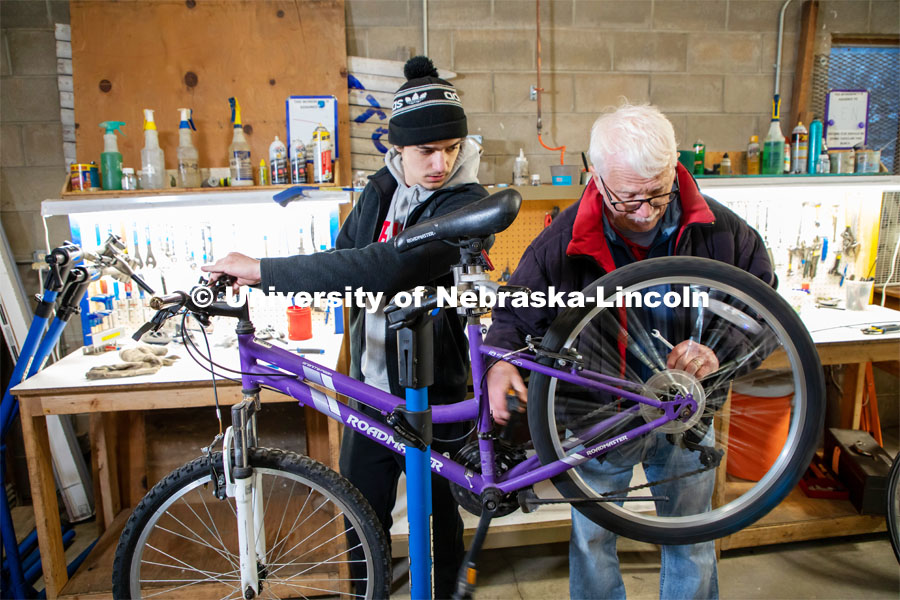 Nebraska Engineering student Jacob Dalton (left) works with mentor Clayton Streich to repair a bike in the Lincoln Bike Kitchen. The Bike Kitchen is among a number of local organizations that the College of Engineering works with to offer service learning opportunities to its students. March 9, 2023. Photo by Dillon Galloway for University Communication.