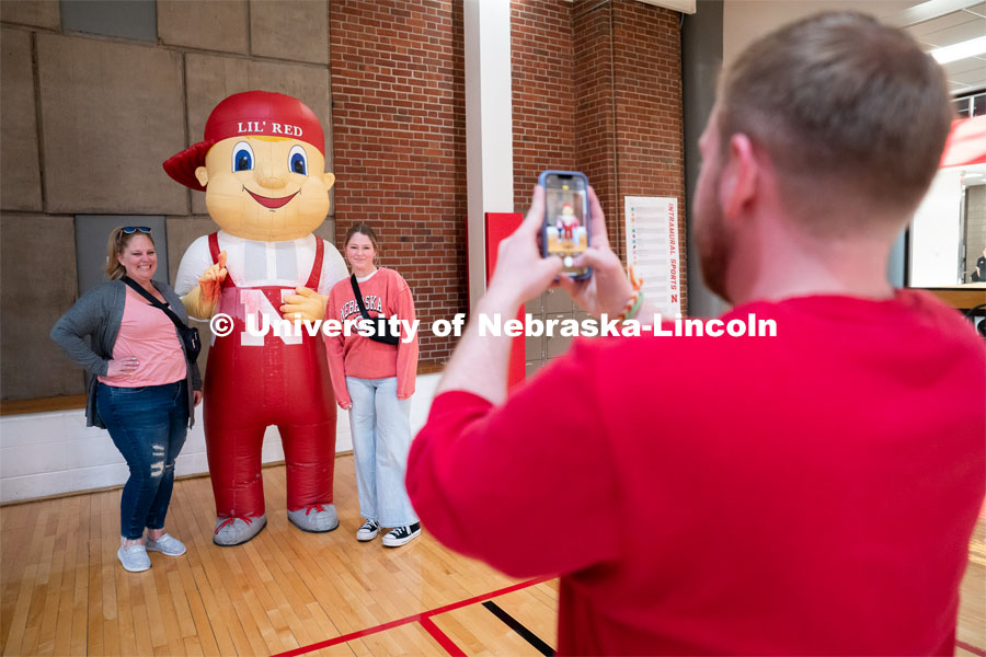 New students get their picture taken with Lil’ Red during Admitted Student Day inside University of Nebraska-Lincoln Campus Recreation Center. Admitted Student Day is UNL’s in-person, on-campus event for all admitted students. March 24, 2023. Photo by Jordan Opp for University Communication.