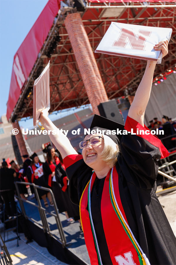 Aaliyah Ann Miller cheers after receiving her CEHS diploma. Undergraduate commencement at Memorial Stadium. May 20, 2023. Photo by Craig Chandler / University Communication.