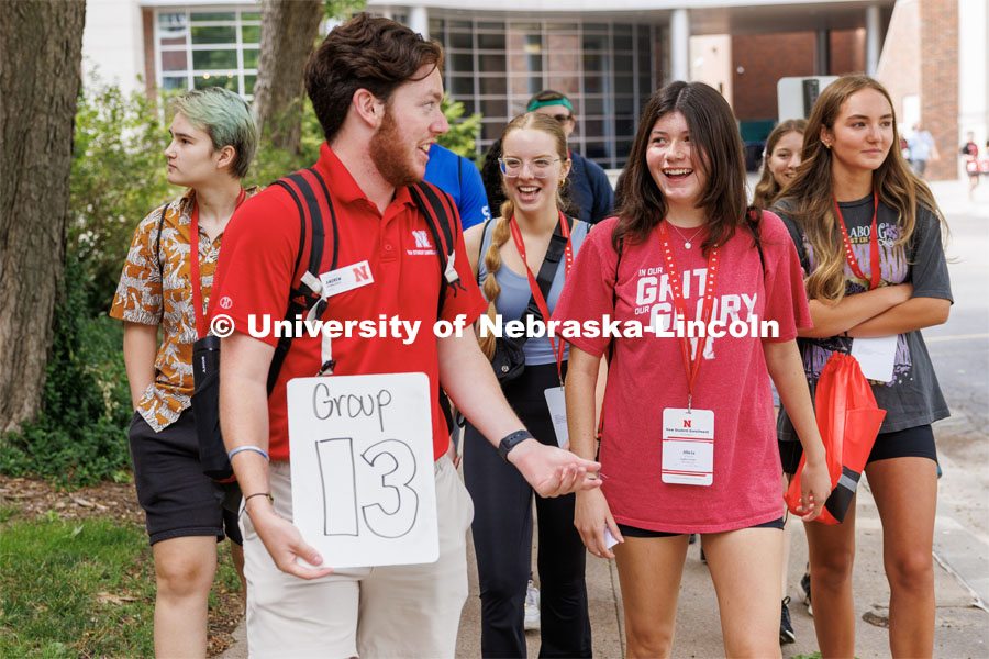 Andrew Stubblefield talks with Alicia Hernandez of Waterloo, Nebraska, as his group tours campus. New Student Enrollment. July 6, 2023. Photo by Craig Chandler / University Communication.