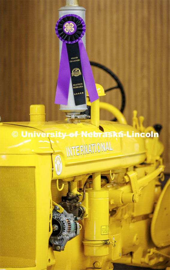 A yellow International tractor wins a purple ribbon at the 4H/FFA Beef Show at the Gage County Fair and Expo in Beatrice. July 28, 2023. Photo by Craig Chandler / University Communication.
