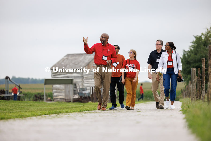 Chancellor Rodney Bennett admires the architecture of the Homestead National Historic Park near Beatrice as the tour group walks the grounds. IANR Roads Scholar Tour through Nebraska. August 1, 2023. Photo by Craig Chandler / University Communication.