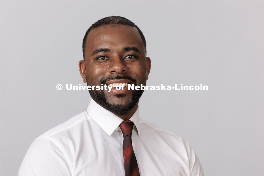 Studio portrait of Akeem Holmes, Senior Assistant Director for Next Chapter Programs. ASEM Admissions counselor. August 14, 2023. Photo by Craig Chandler/ University Communication.
