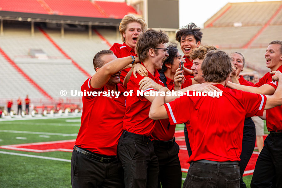 Gavin Addleman celebrates with his section after winning the famous "drill down". Big Red Welcome week featured the Cornhusker Marching Band Exhibition in Memorial Stadium where they showed highlights of what the band has been working on during their pre-season Band Camp, including their famous “drill down”. August 18, 2023. Photo by Sammy Smith / University Communication.