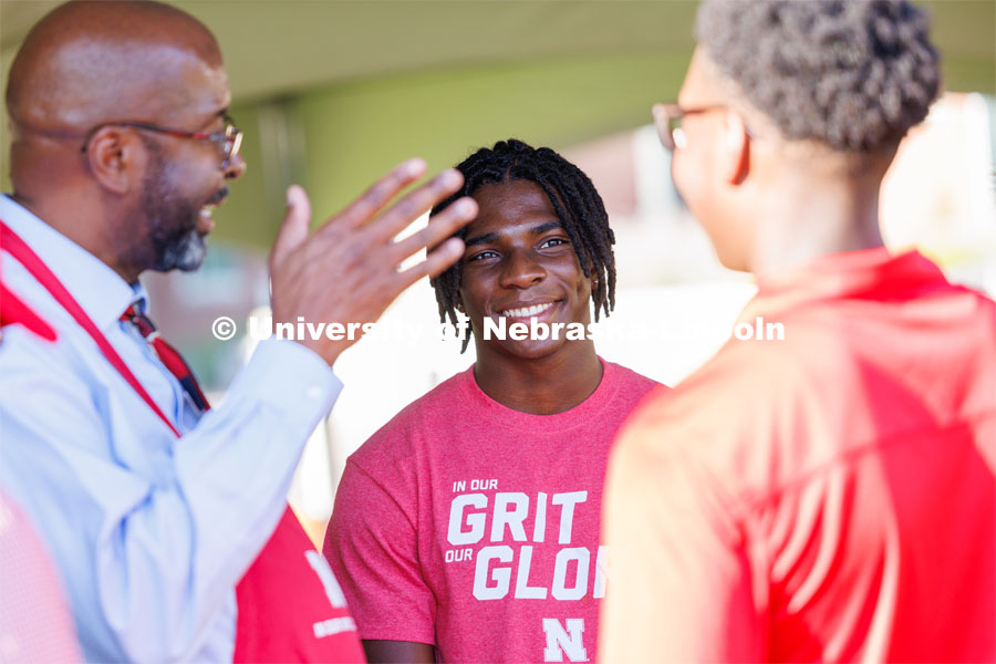 Chancellor Rodney Bennet talks with students at the Chancellor’s BBQ in the green space between the Nebraska Union and Kauffmann Academic Residence Center. August 18, 2023. Photo by Matthew Strasburger / University Communication.